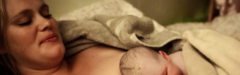 Newborn baby laying on mom's bare chest | Exploring birth options