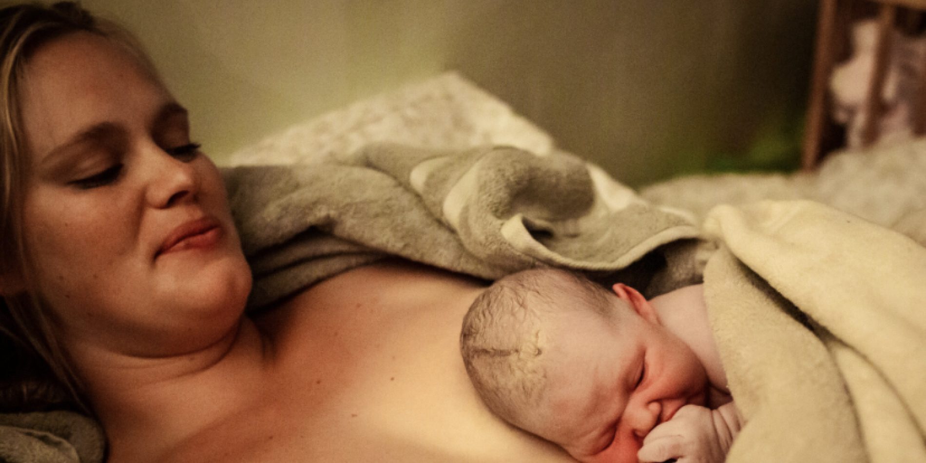 Newborn baby laying on mom's bare chest | Exploring birth options